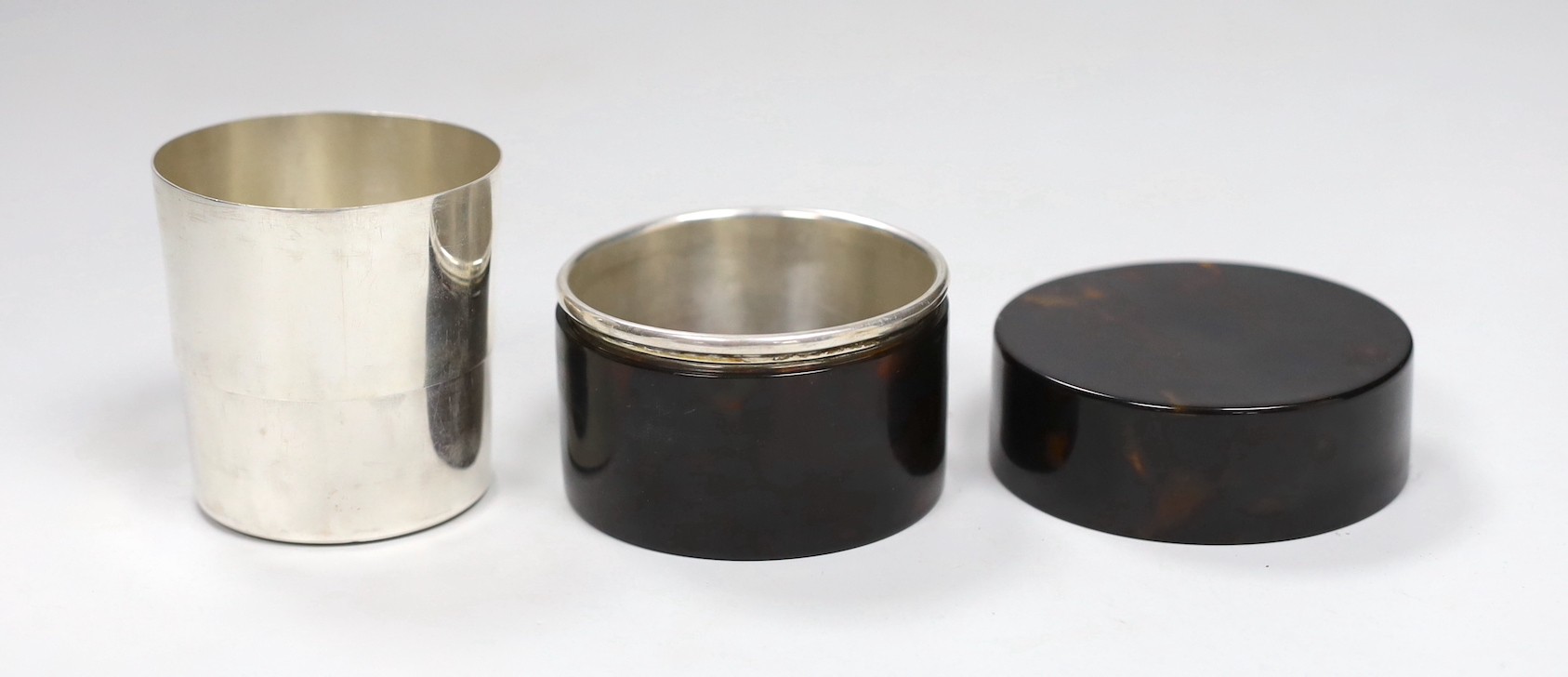 A Victorian tortoiseshell and ivory mounted pen and ink box, 10.5cm and a Chinese white metal telescopic tumbler in a tortoiseshell box